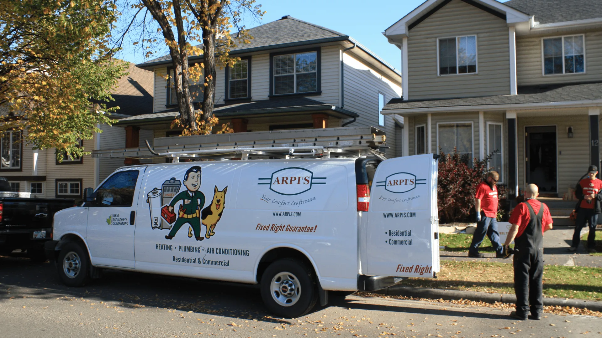 Arpi's technicians arriving for a Lennox furnace replacement at a Calgary home, service van parked curbside